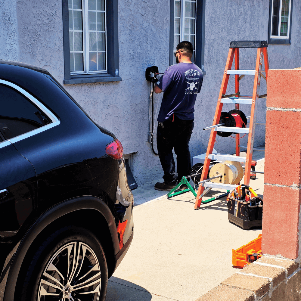 Electricians installing EV charger