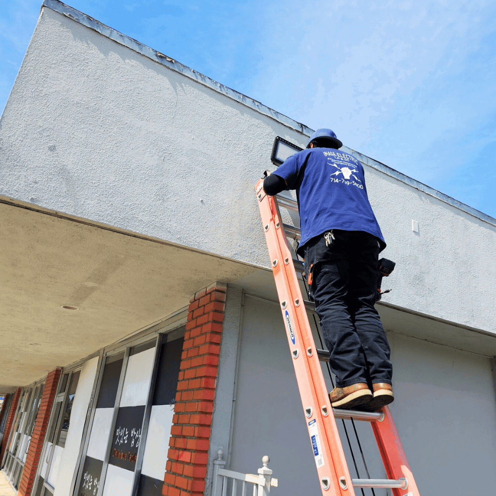 Electricians reviewing blueprints