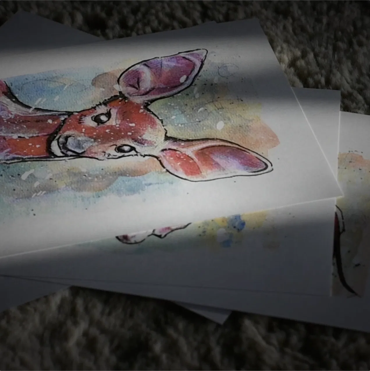 Six paints lay across a sheep skin rug, the top is an abstract figurative portrait of a female deer from Jamie's recent painting series 21092025 jamie c goodwin jamiehaswings