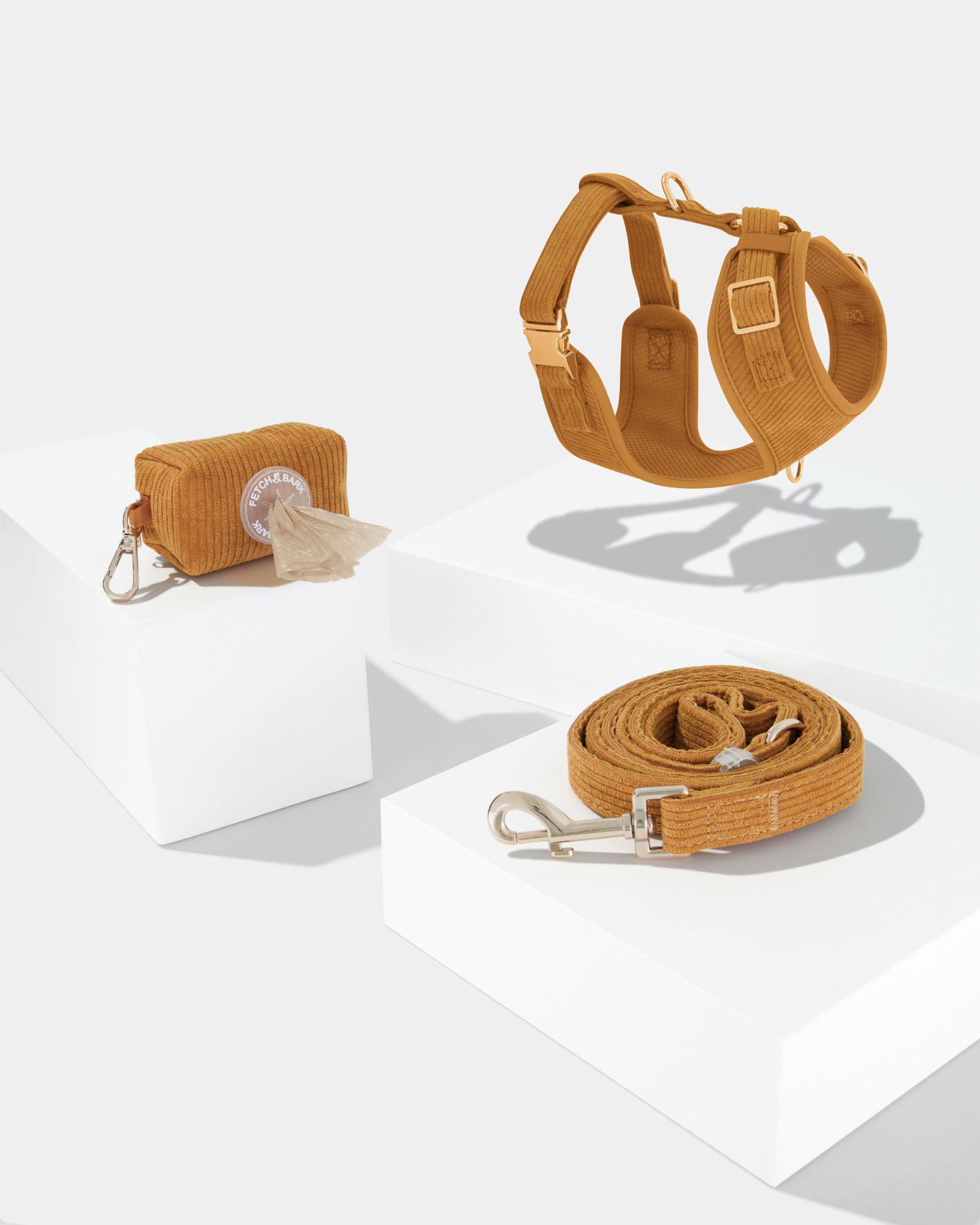 Set of dog accessories photographed in a Brisbane studio, highlighting design, materials, and practical storage features