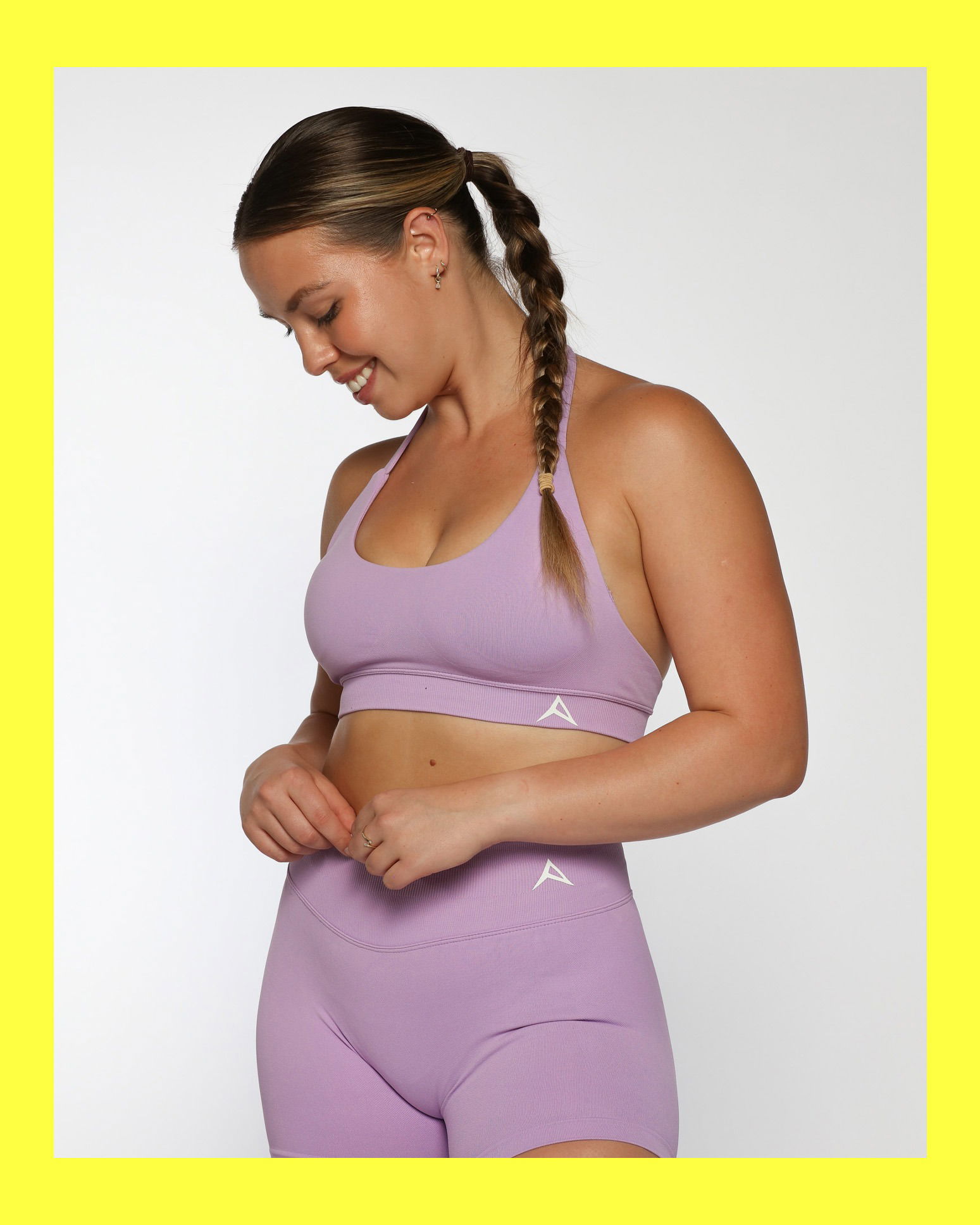 Model wearing a purple activewear top for fitness lifestyle photography