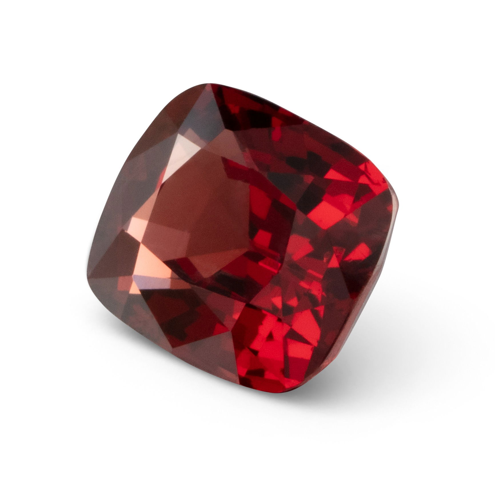 Side view of a ruby gemstone photographed in a Brisbane studio, showing depth, facets, and color intensity