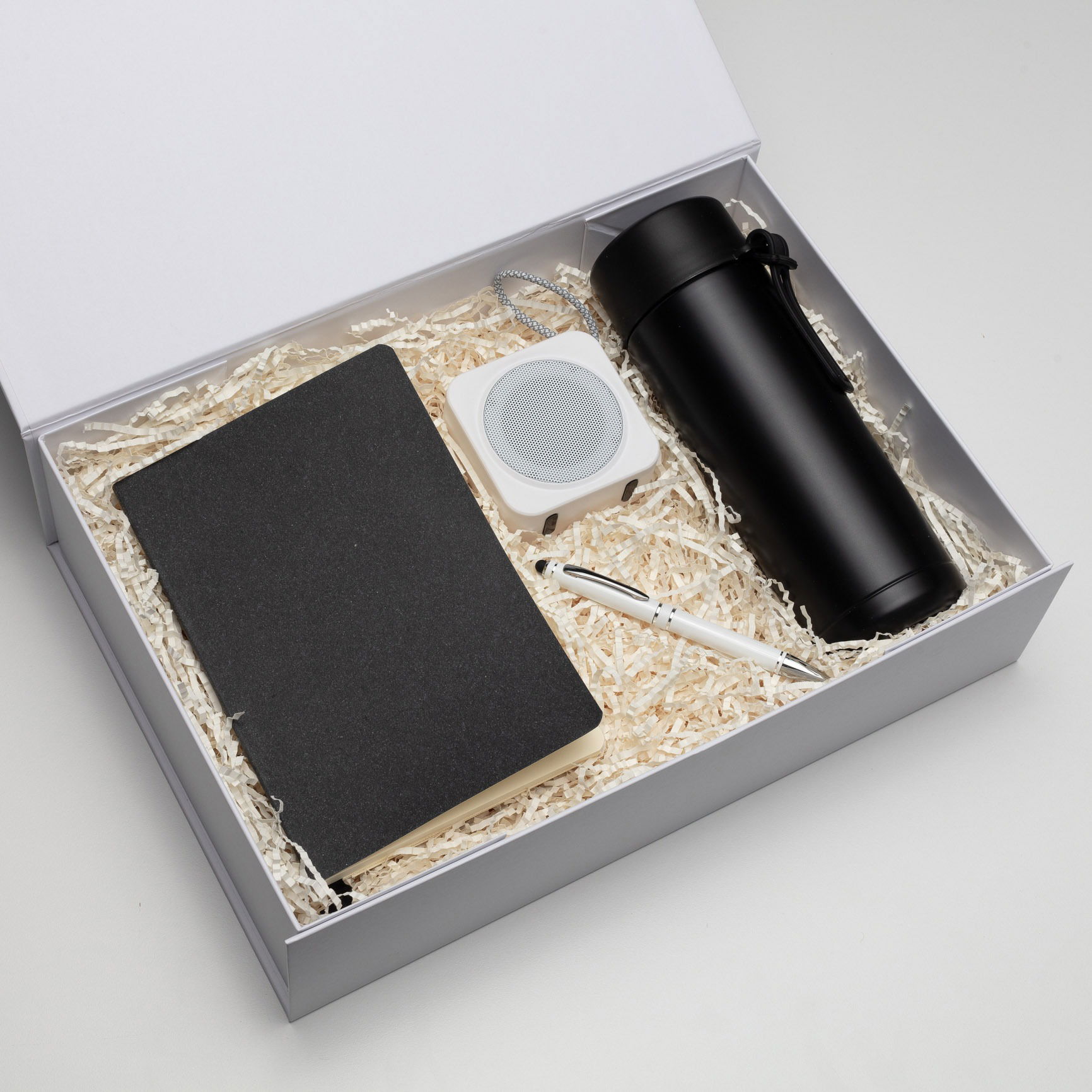 Stationery gift set with pen, notebook, and water bottle, captured professionally in a Brisbane studio.