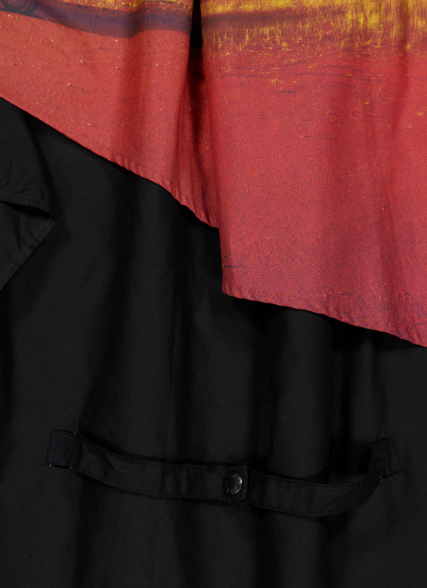 High-quality flatlay shot highlighting intricate embroidery and fabric texture.