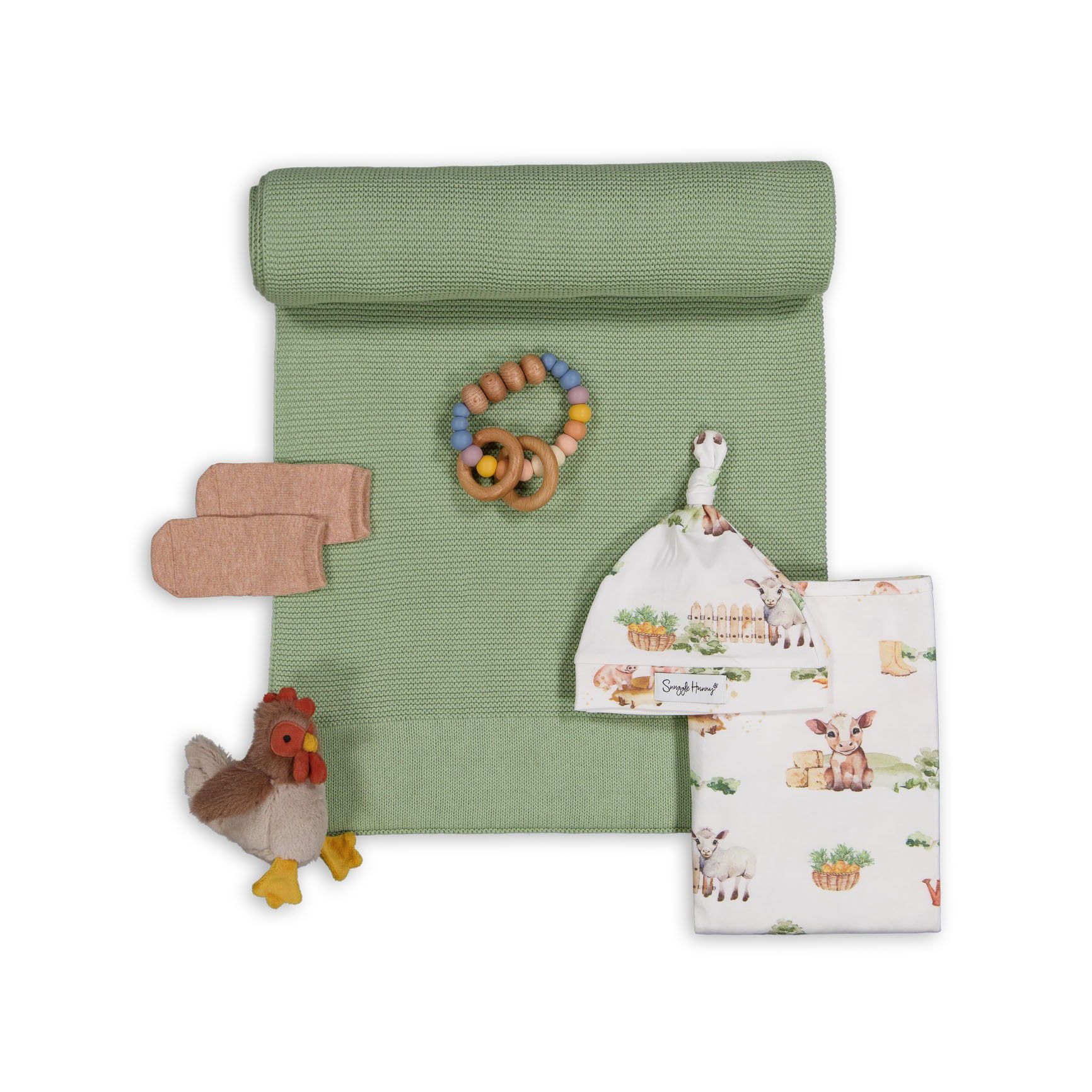 Brisbane photography of a baby gift set, showing blankets, clothes, and accessories in a neat arrangement.