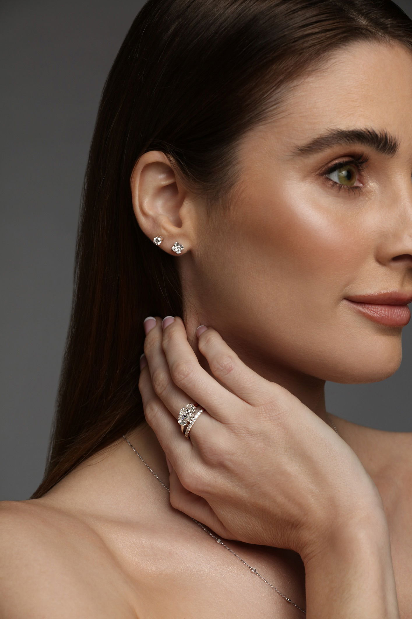 Luxury fine jewellery set with necklace, ring, and earring photographed on model in studio