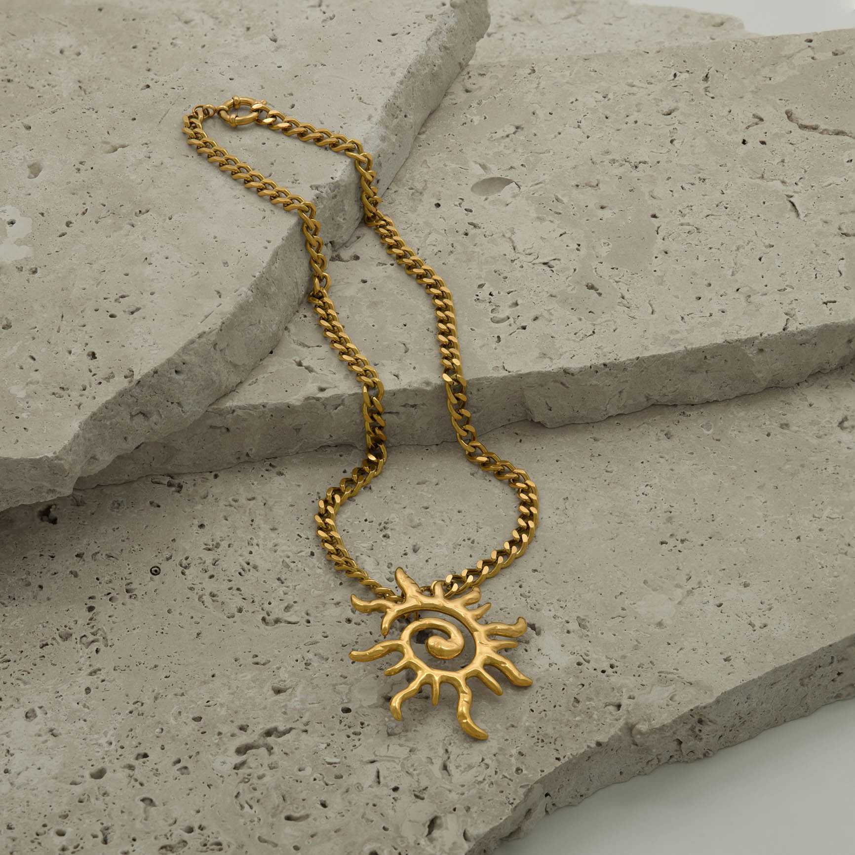Necklace styled on natural stones and photographed in a Brisbane studio, highlighting design, texture, and visual appeal for lifestyle and marketing images