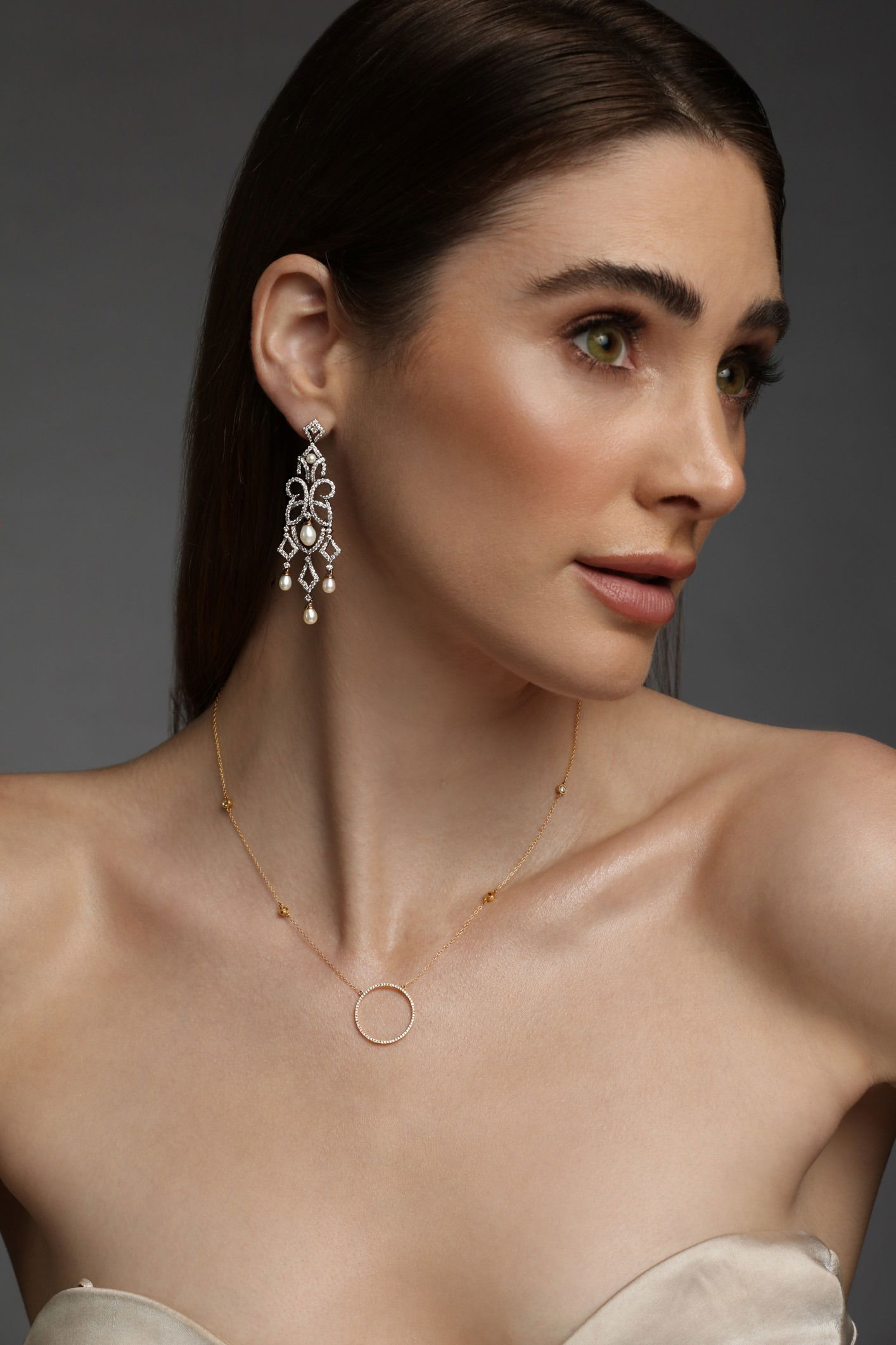 Luxury fine jewellery set worn by model and photographed in a professional studio environment