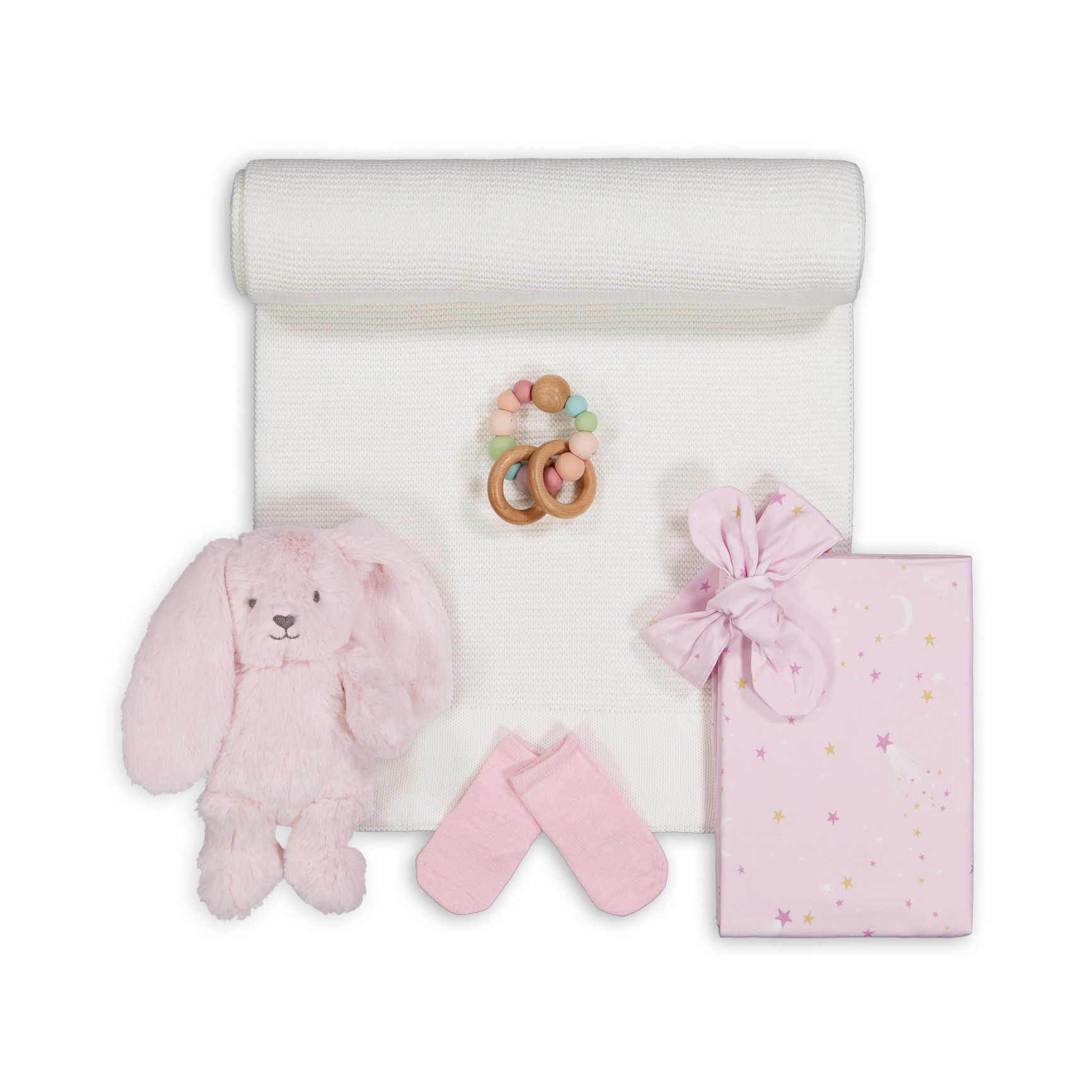 Curated baby gift set with blanket and stuffed animal, professionally captured in a Brisbane studio.