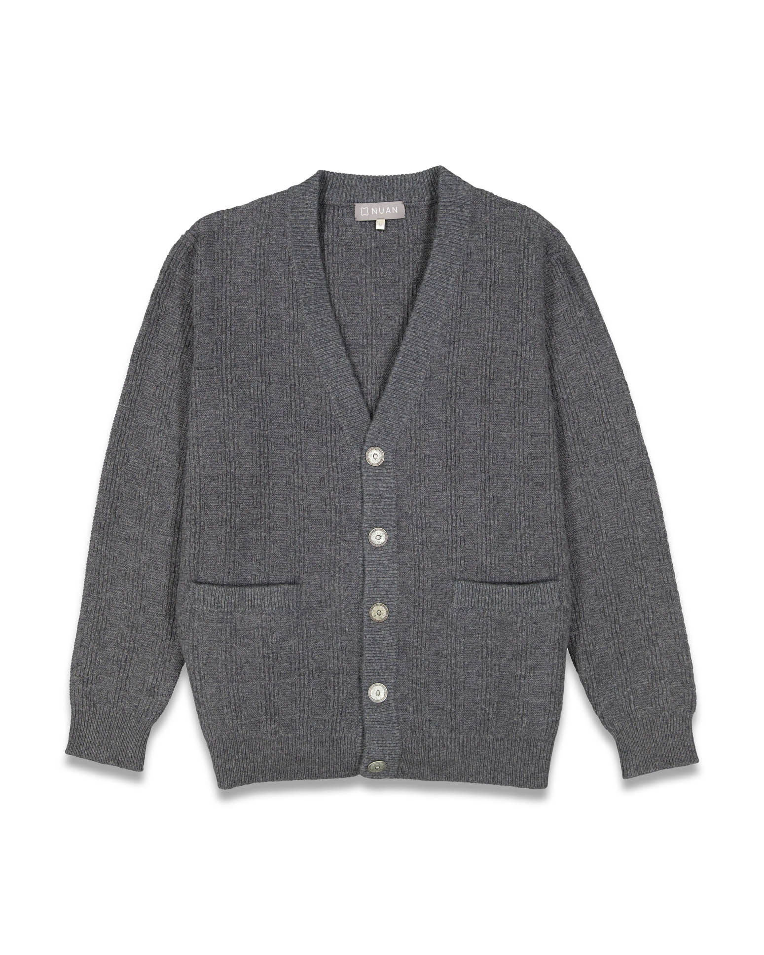 Detailed flat lay shot of a sweater, focusing on texture and craftsmanship.