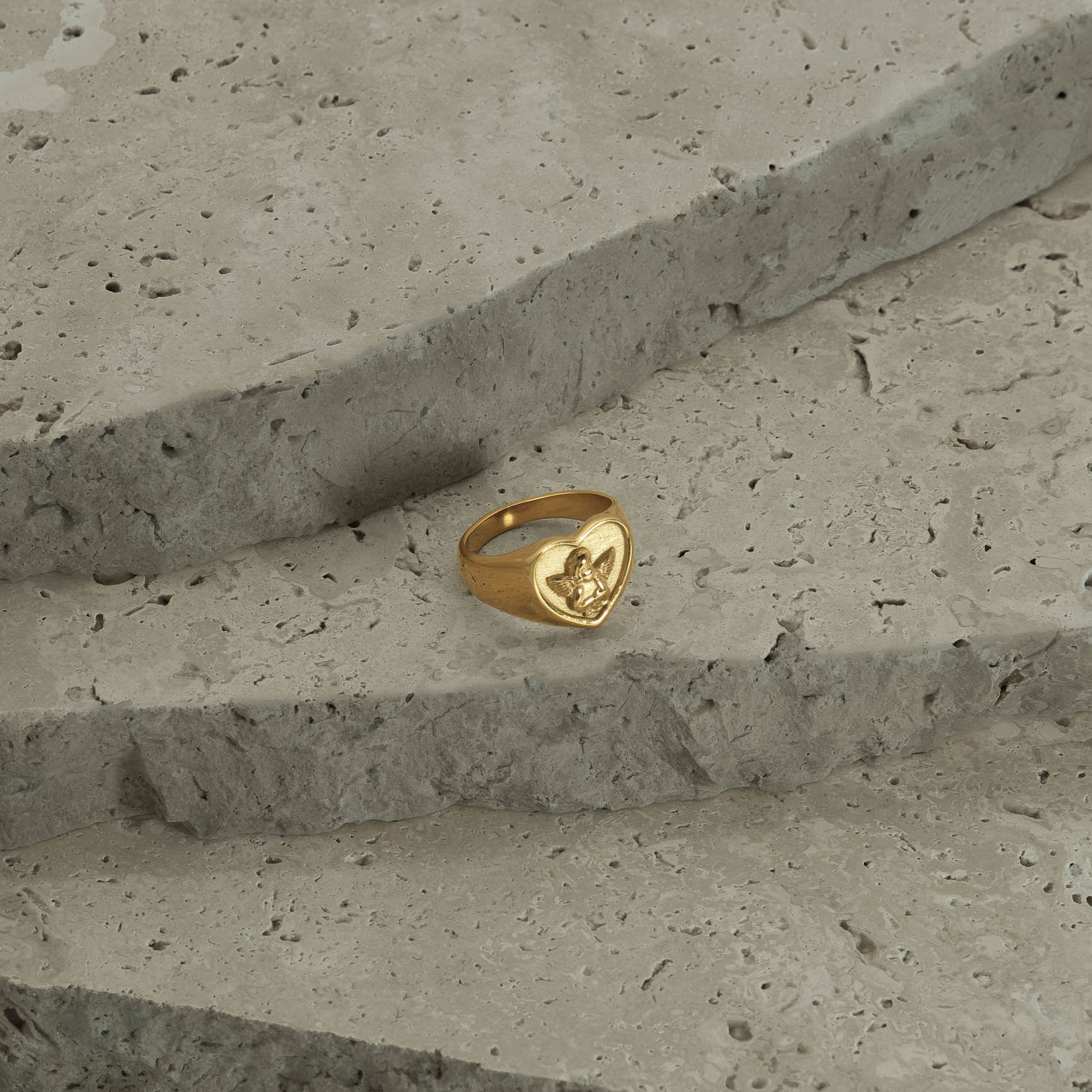 Ring styled on natural stones and photographed in a Brisbane studio, highlighting design, texture, and visual appeal for lifestyle and marketing images