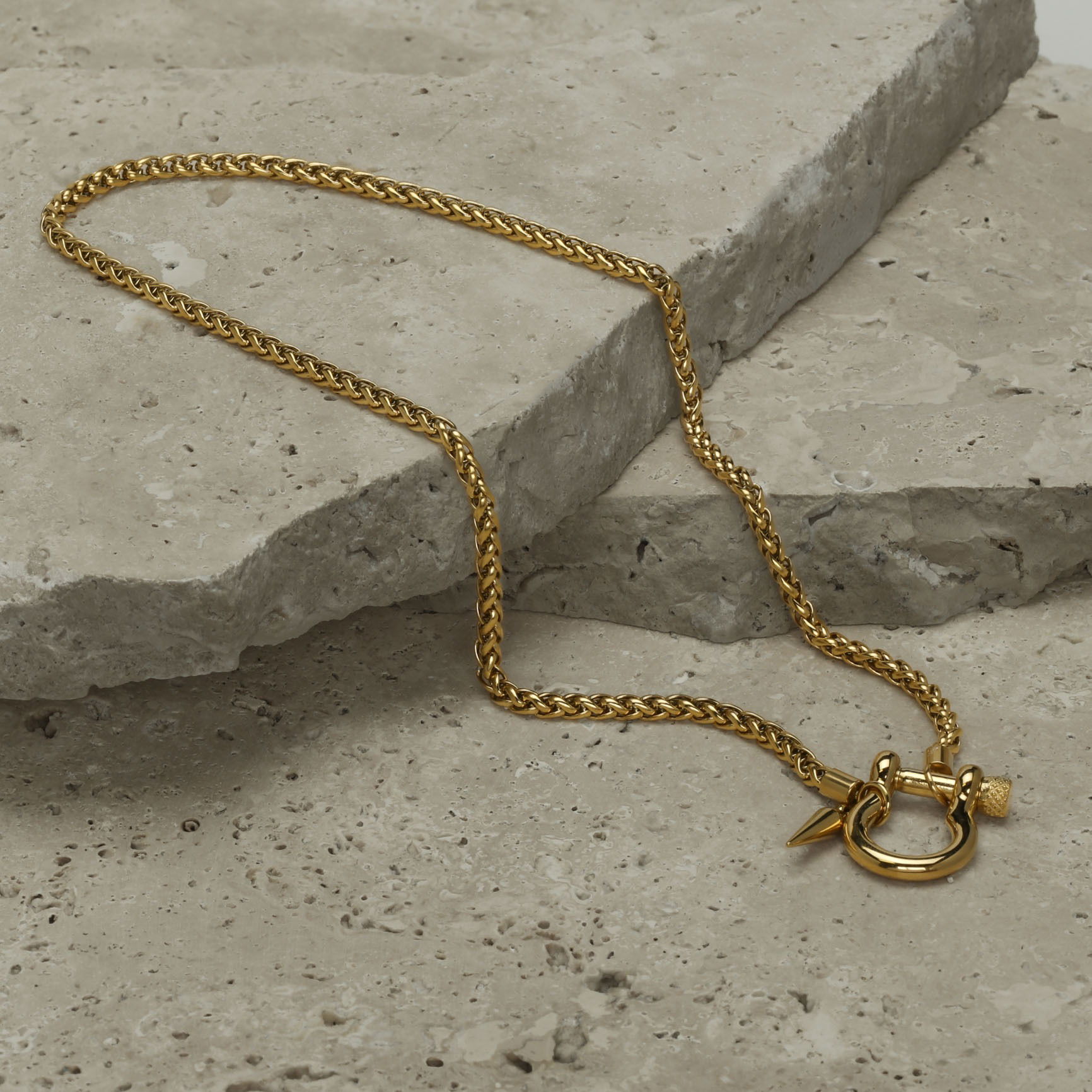 Necklace styled on natural stones and photographed in a Brisbane studio, highlighting design, texture, and visual appeal for lifestyle and marketing images