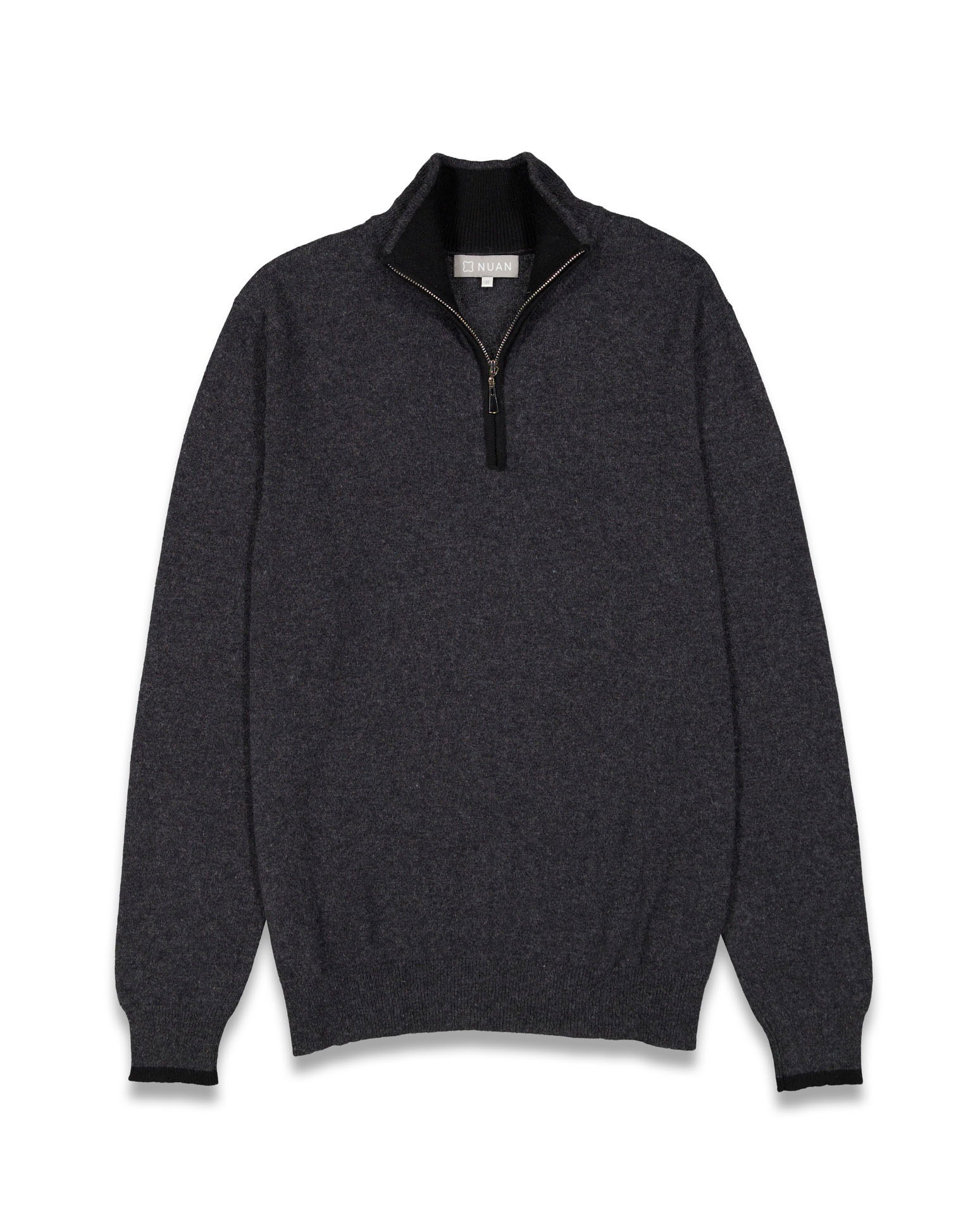 Detailed flat lay shot of a sweater, focusing on texture and craftsmanship.